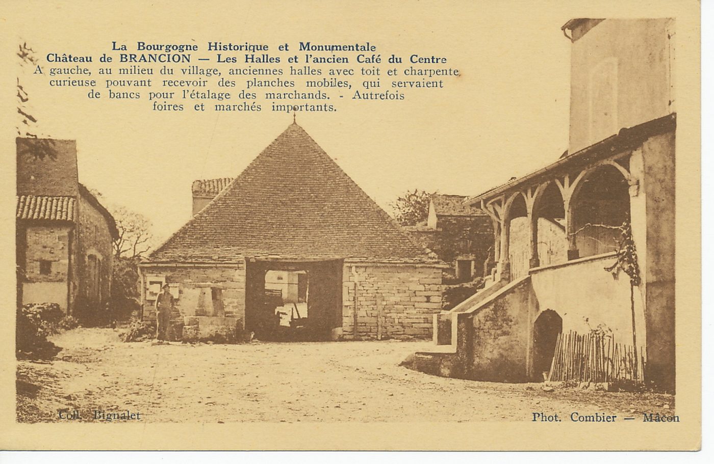 La Bourgogne historique et monumentale. Château de Brancion. Les halles et l'ancien café du Centre. A gauche, au milieu du village, anciennes halles avec toit et charpente curieuse pouvant recevoir des planches mobiles, qui servaient de bancs pour l'étalage des marchands. Autrefois foires et marchés importants.